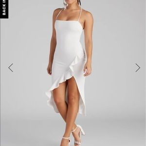 White dress with a slit in it.
